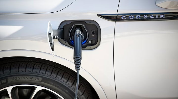An electric charger is shown plugged into the charging port of a Lincoln Corsair® Grand Touring
model. | North Park Lincoln in San Antonio TX