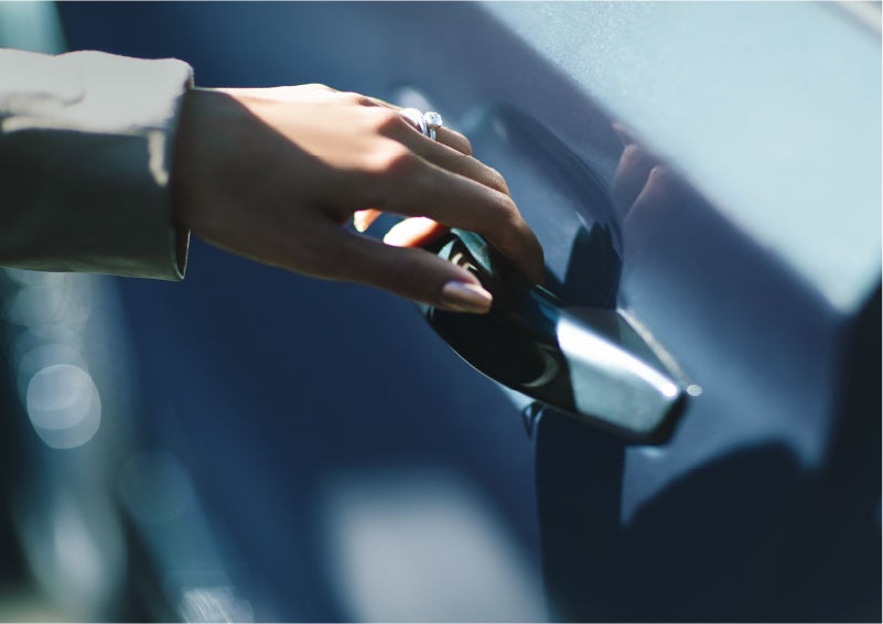 A hand gracefully grips the Light Touch Handle of a 2023 Lincoln Aviator® SUV to demonstrate its ease of use | North Park Lincoln in San Antonio TX