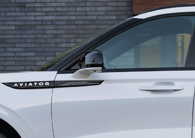 The driver’s door of a white 2025 Lincoln Aviator® SUV is showcased. | North Park Lincoln in San Antonio TX
