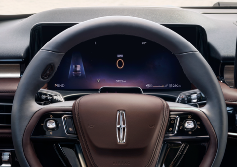 The steering wheel of 2025 Lincoln Aviator® SUV is shown with black and brown accents. | North Park Lincoln in San Antonio TX