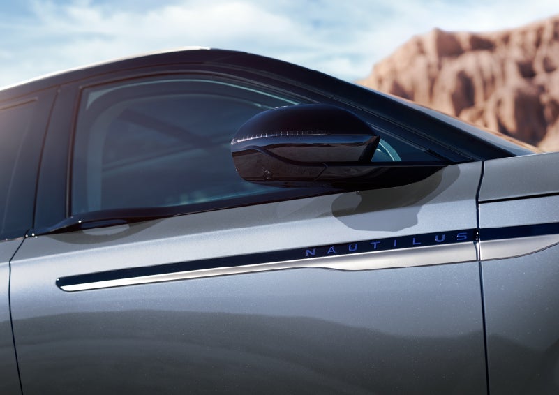 Blue lettering on the side of the vehicle that reads nautilus indicates the available hybrid powertrain. | North Park Lincoln in San Antonio TX