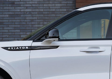 The driver’s side door and fender badging of a white 2026 Lincoln Aviator® SUV are showcased. | North Park Lincoln in San Antonio TX