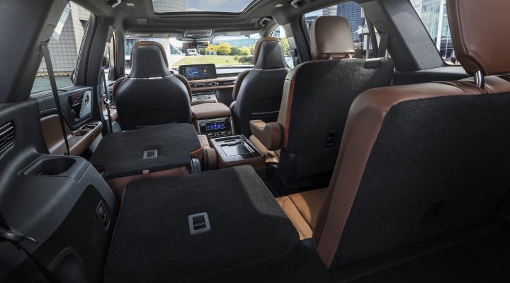One side of the PowerFold® third-row seat and a second-row seat are folded forward in the 2026 Lincoln Aviator® SUV. | North Park Lincoln in San Antonio TX