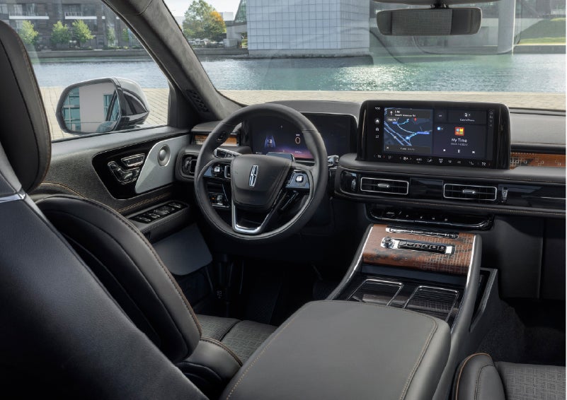 The interior of the 2026 Lincoln Aviator® SUV is shown parked with a view of a harbor through the windshield. | North Park Lincoln in San Antonio TX