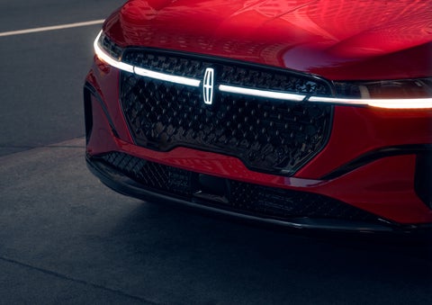 The available front LED light bar and center Lincoln Star logo glow at dusk. | North Park Lincoln in San Antonio TX