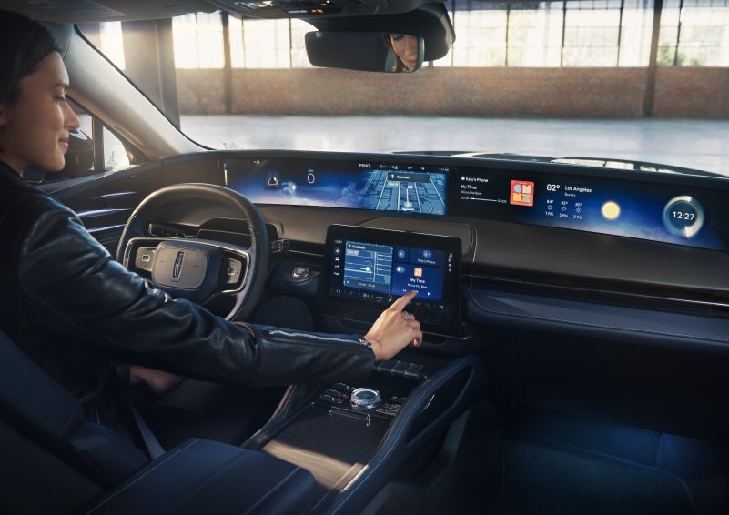 The driver of a 2026 Lincoln Nautilus® SUV interacts with the center touchscreen. | North Park Lincoln in San Antonio TX