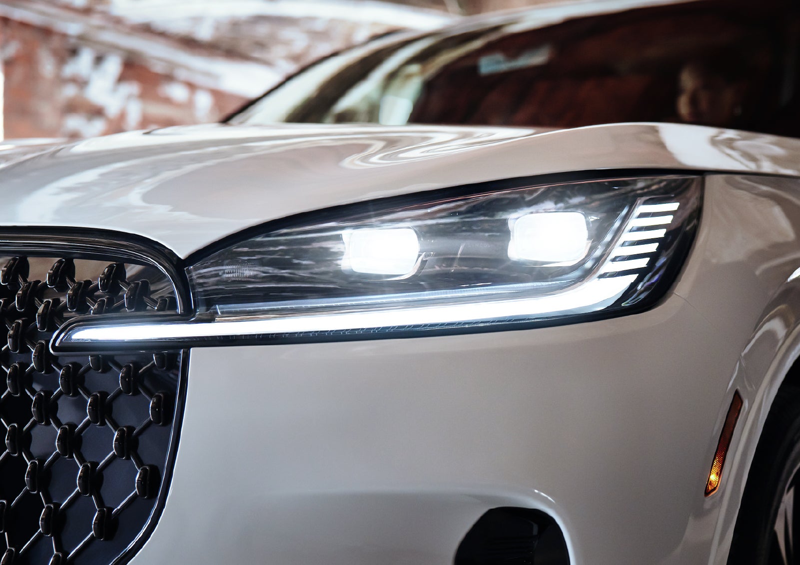 A close-up of a headlamp on the 2027 Lincoln Aviator® SUV is shown. | North Park Lincoln in San Antonio TX