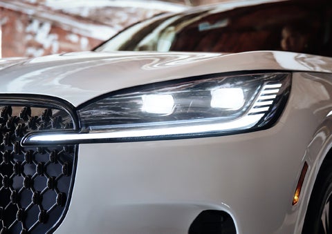 A close-up of a headlamp on the 2027 Lincoln Aviator® SUV is shown. | North Park Lincoln in San Antonio TX