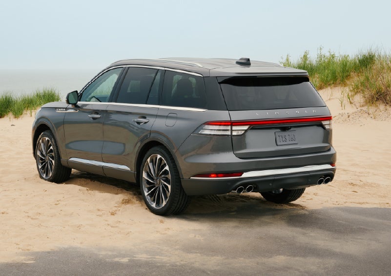 A 2027 Lincoln Aviator® SUV is parked next to sand dunes. | North Park Lincoln in San Antonio TX