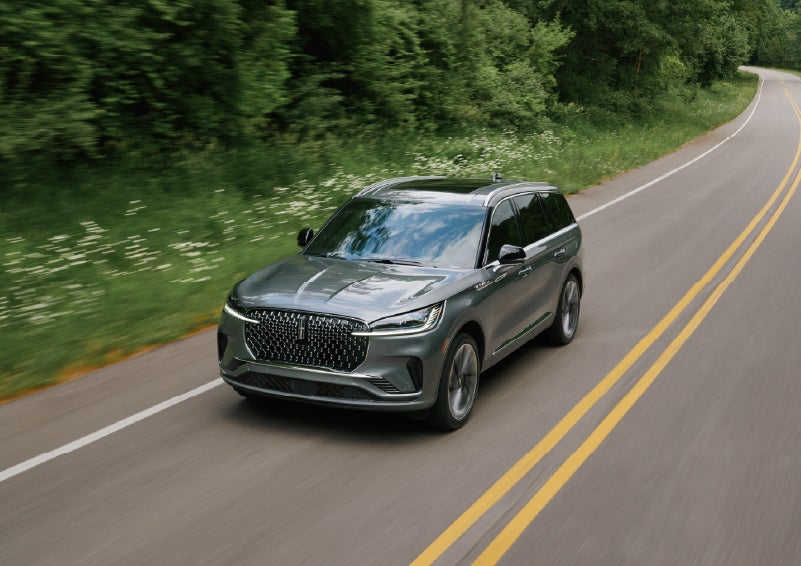 A 2027 Lincoln Aviator® SUV is being driven down a road. | North Park Lincoln in San Antonio TX