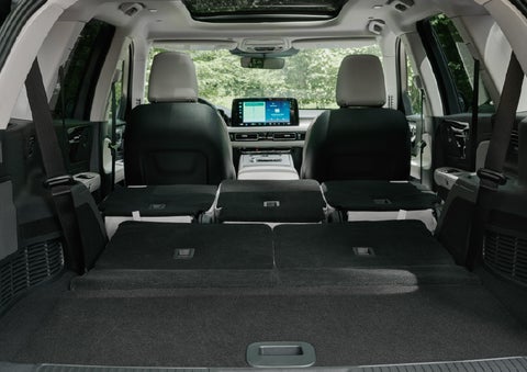 A rear to front view of the interior of a 2027 Lincoln Aviator® Black Label™ SUV shows the third and second rows folded flat | North Park Lincoln in San Antonio TX